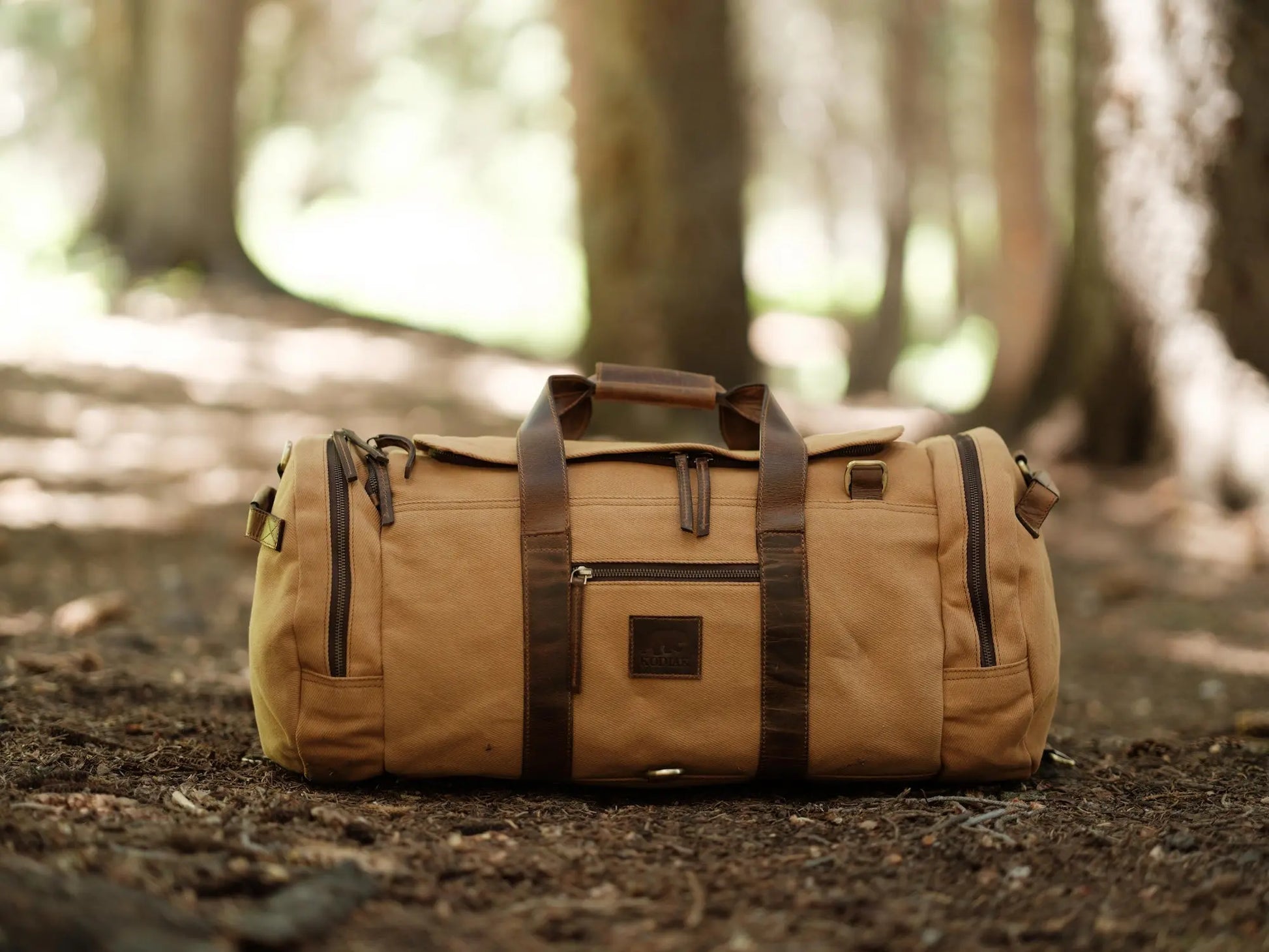 55L Nomad Canvas Duffel Kodiak Leather